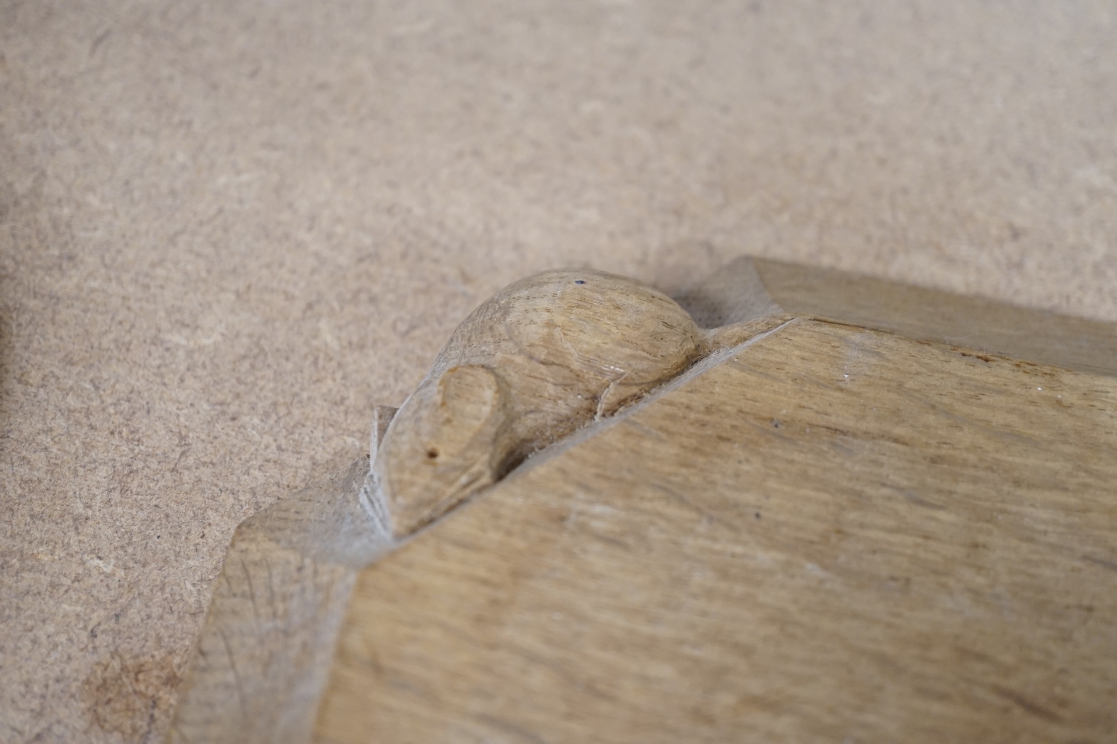 A small carved wooden Mouseman cheese board together with a Mouseman ashtray, largest 19cm wide. Condition - fair to good